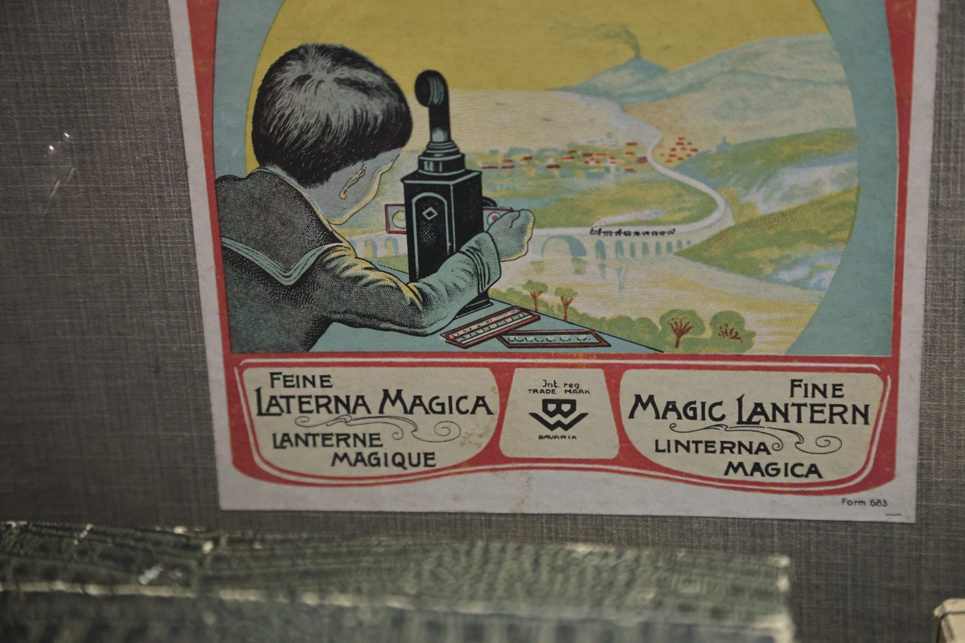 Historisches Plakat mit einer Zeichnung eines Fotografen und einer Landschaft.